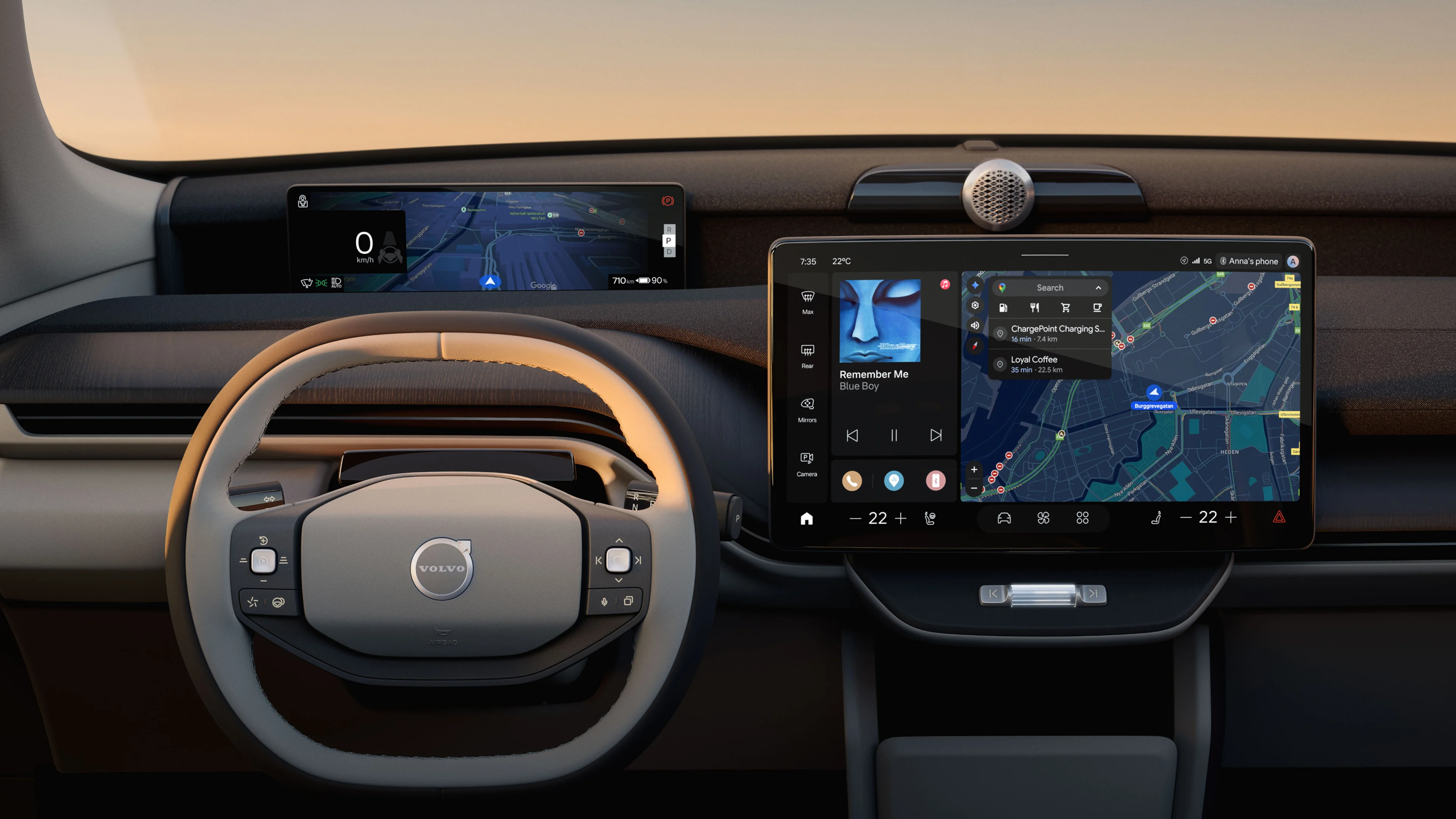 Volvo cabin at sunset: the steering wheel, a driver display showing a map at 0 km/h, and the center screen with music, navigation, and climate controls