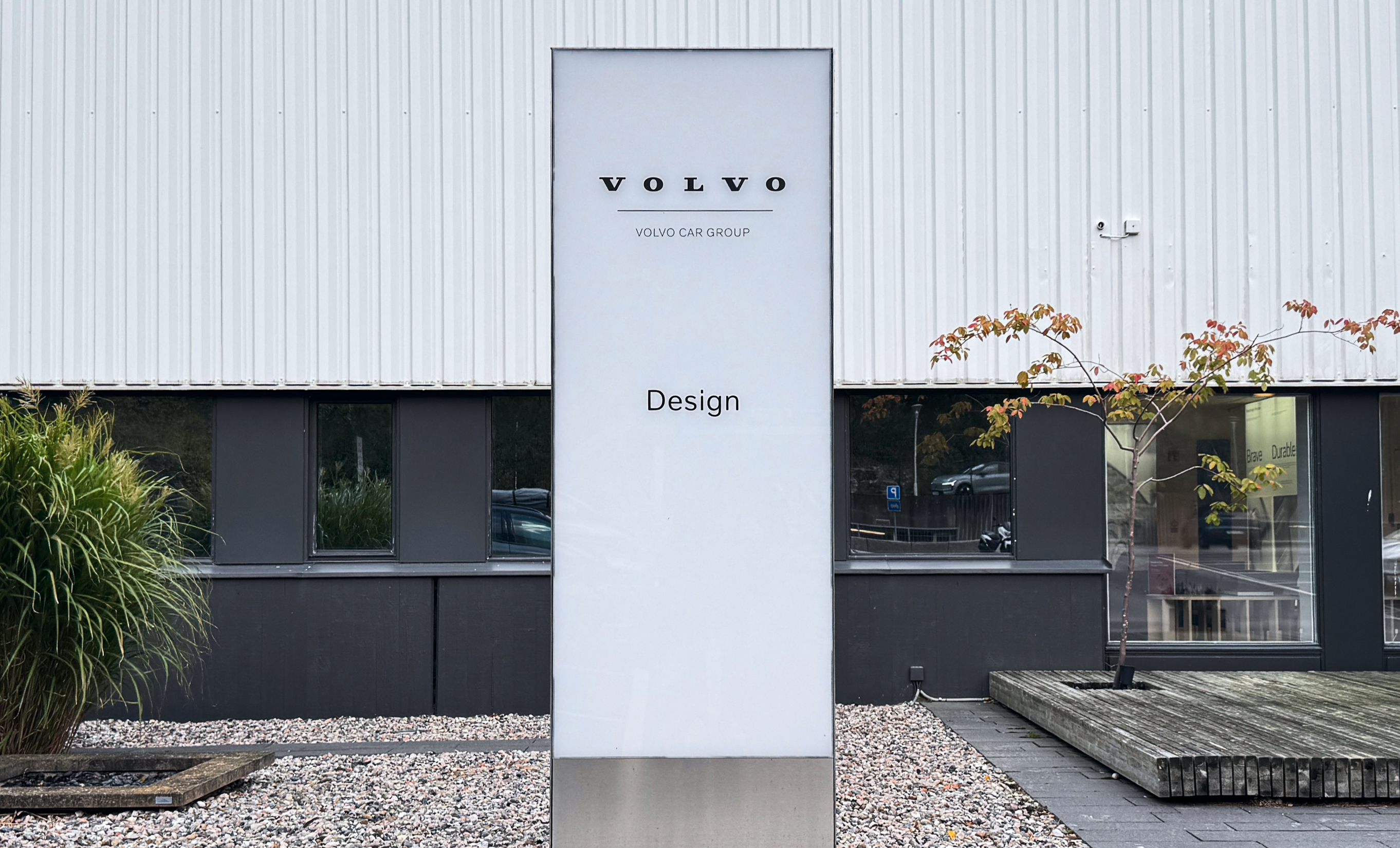 The Volvo Car Group Design sign outside the design studio, in autumn