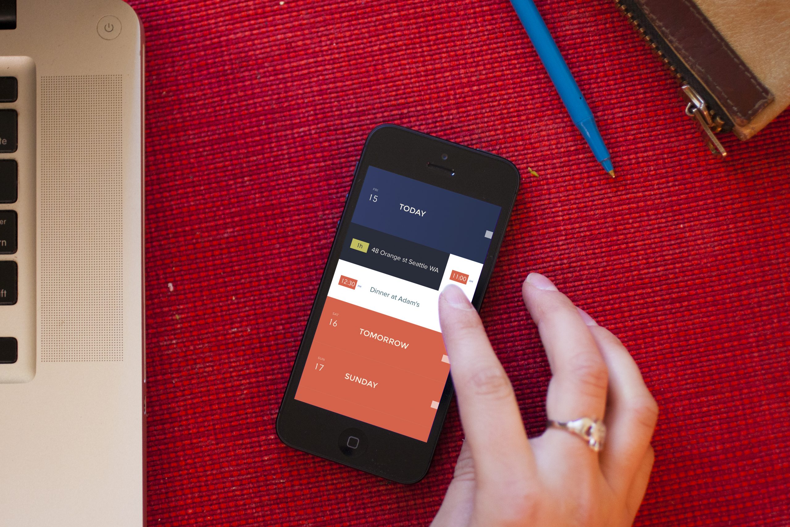 Phone on a desk showing Peek Calendar with a swipe interaction to add an event