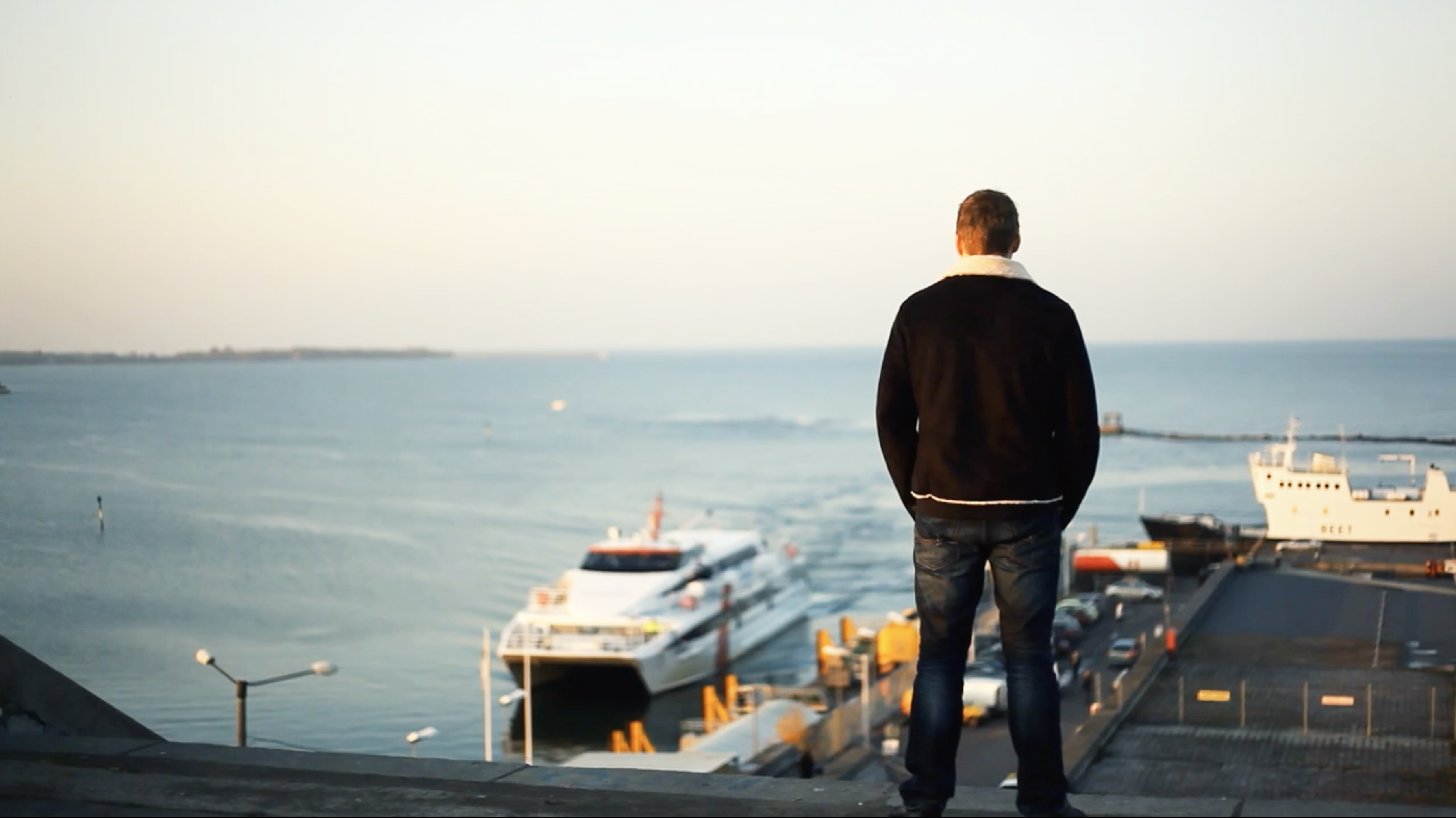 A person looking out over the harbor in Tallinn, Estonia
